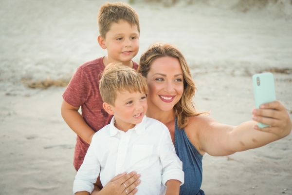 boy's white dress shirt and women's blue sleeveless top