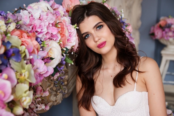 Portrait of Woman With Pink Roses