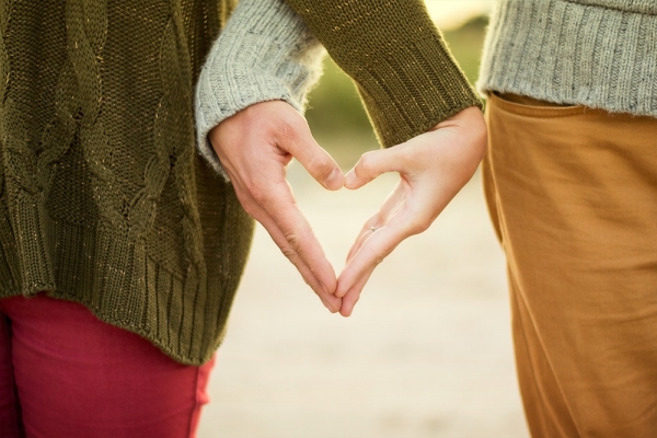 man and woman hugging each other photography