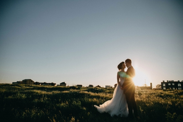 pide and groom on green grass field